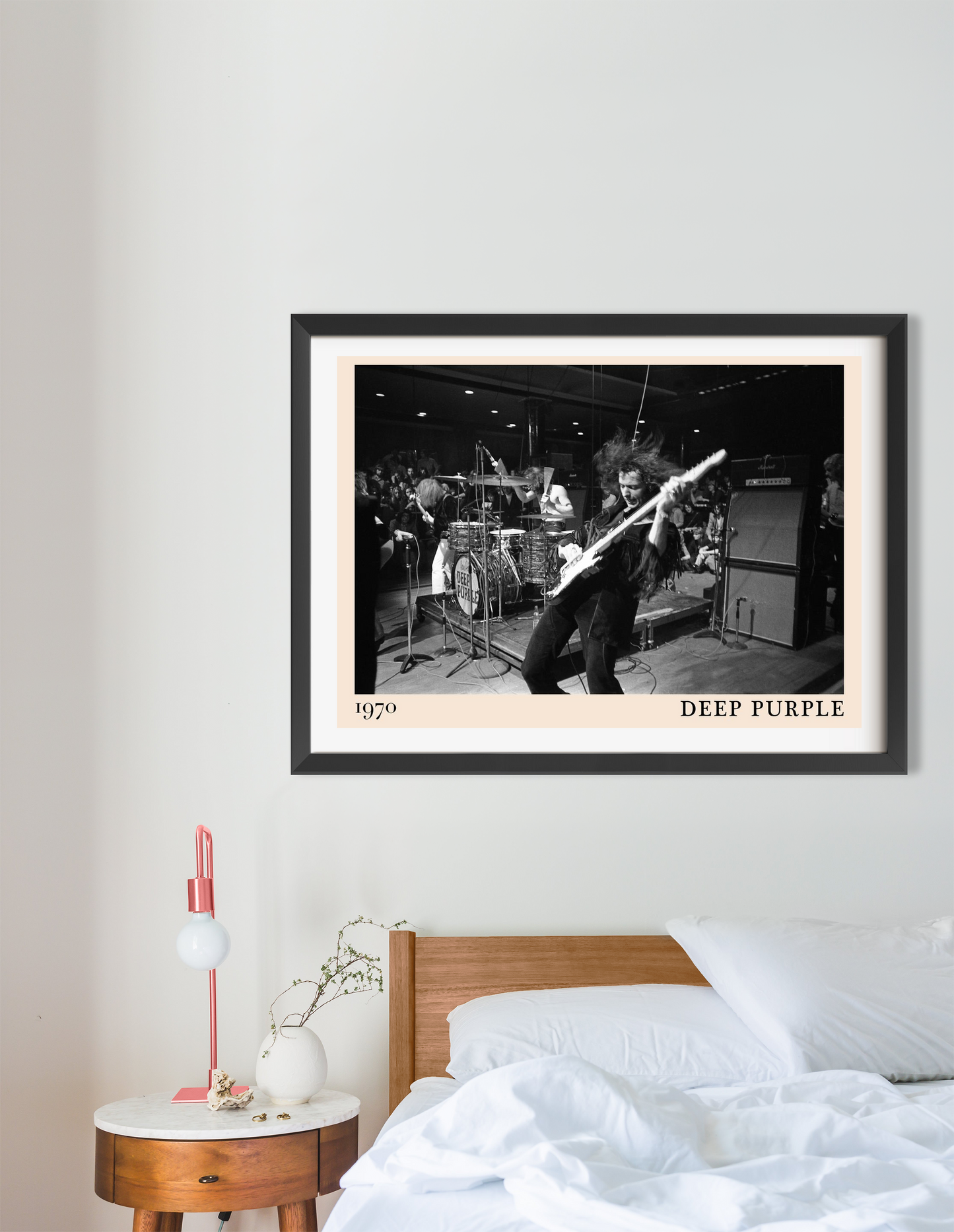 Deep Purple Rock Concert Poster in landscape 16 mount mockup above bed, black and white band photo and modern bedroom decor.