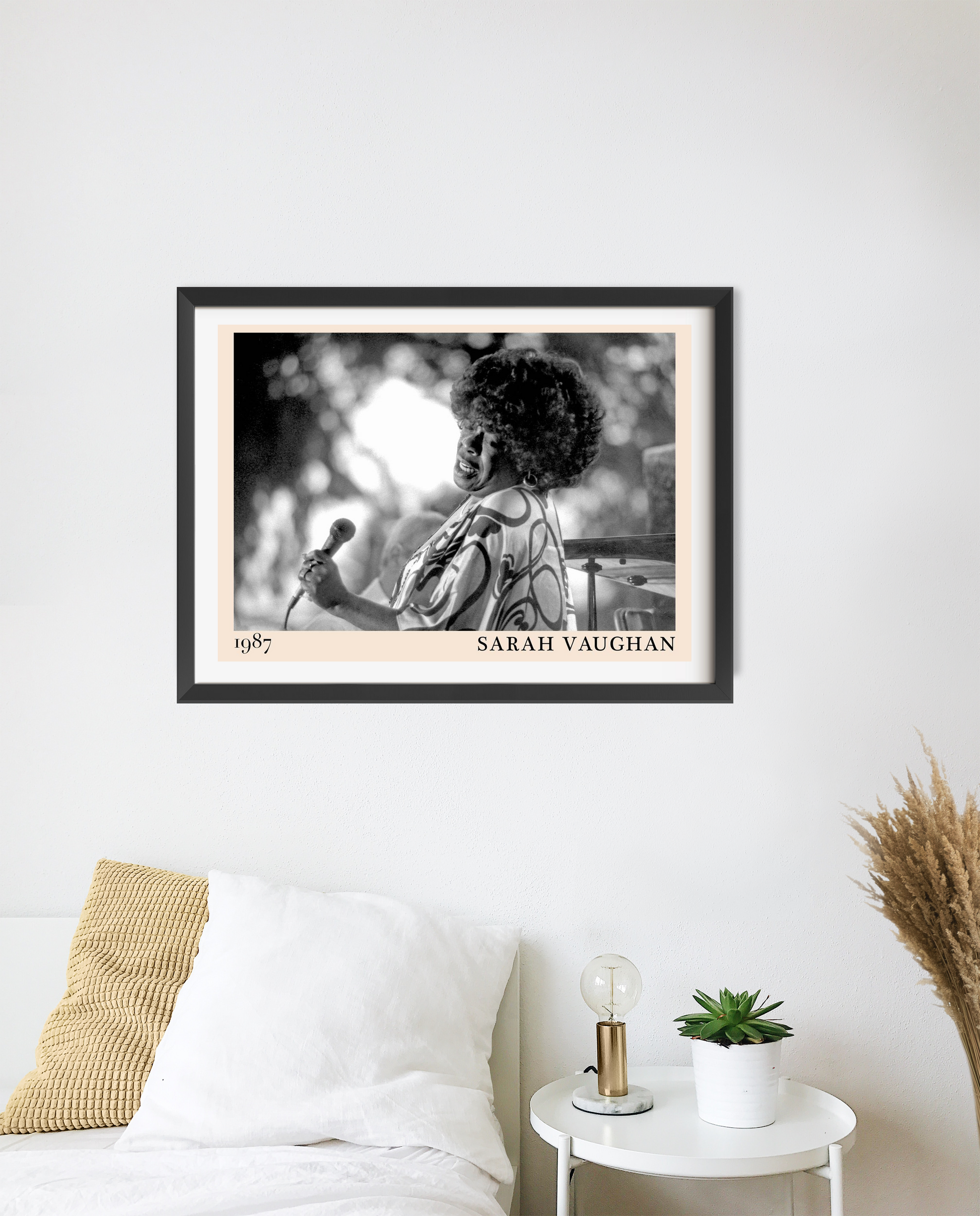 Sarah Vaughan Jazz Poster in landscape 20 mount mockup, black and white portrait above modern bed with cozy decor elements.