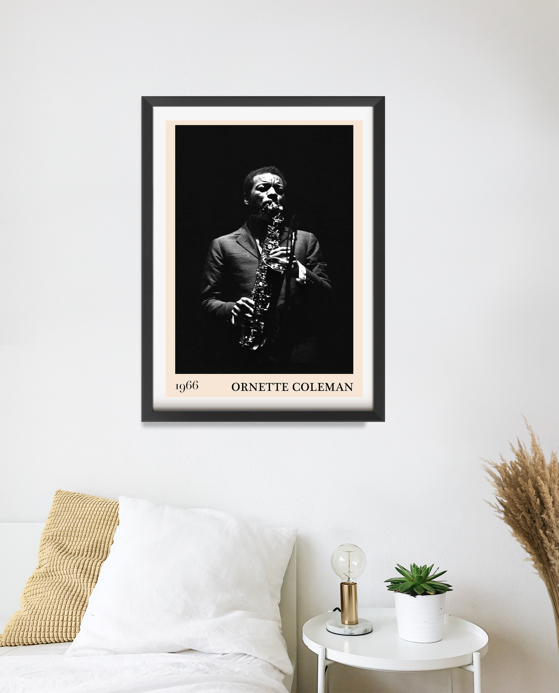 Ornette Coleman vintage jazz poster in 20 mount portrait mockup, black and white design above modern bed decor setup.