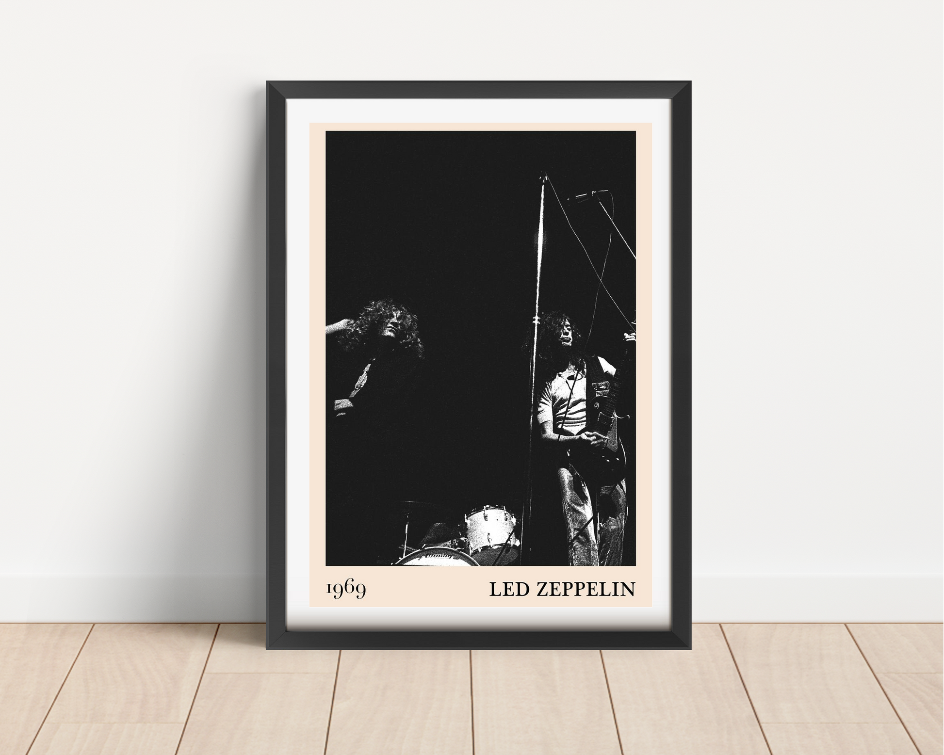 Led Zeppelin vintage rock poster in portrait main mount mockup, black frame on wooden floor, 1969 concert design featured.