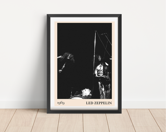 Led Zeppelin vintage rock poster in portrait main mount mockup, black frame on wooden floor, 1969 concert design featured.