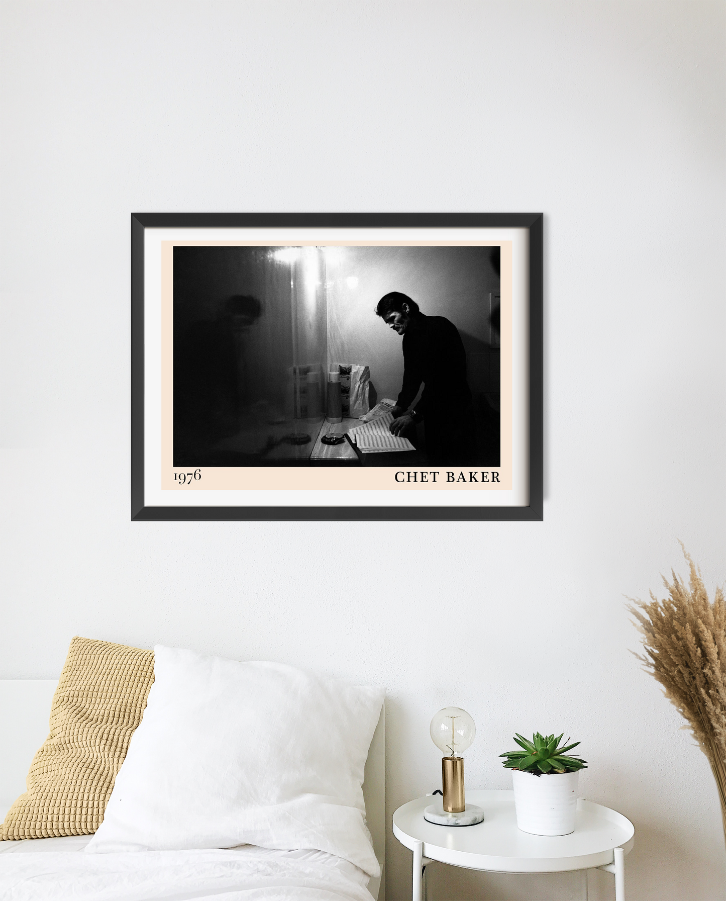 Chet Baker Retro Jazz Poster in landscape mount mockup, black and white photo above bed, modern minimalist bedroom decor