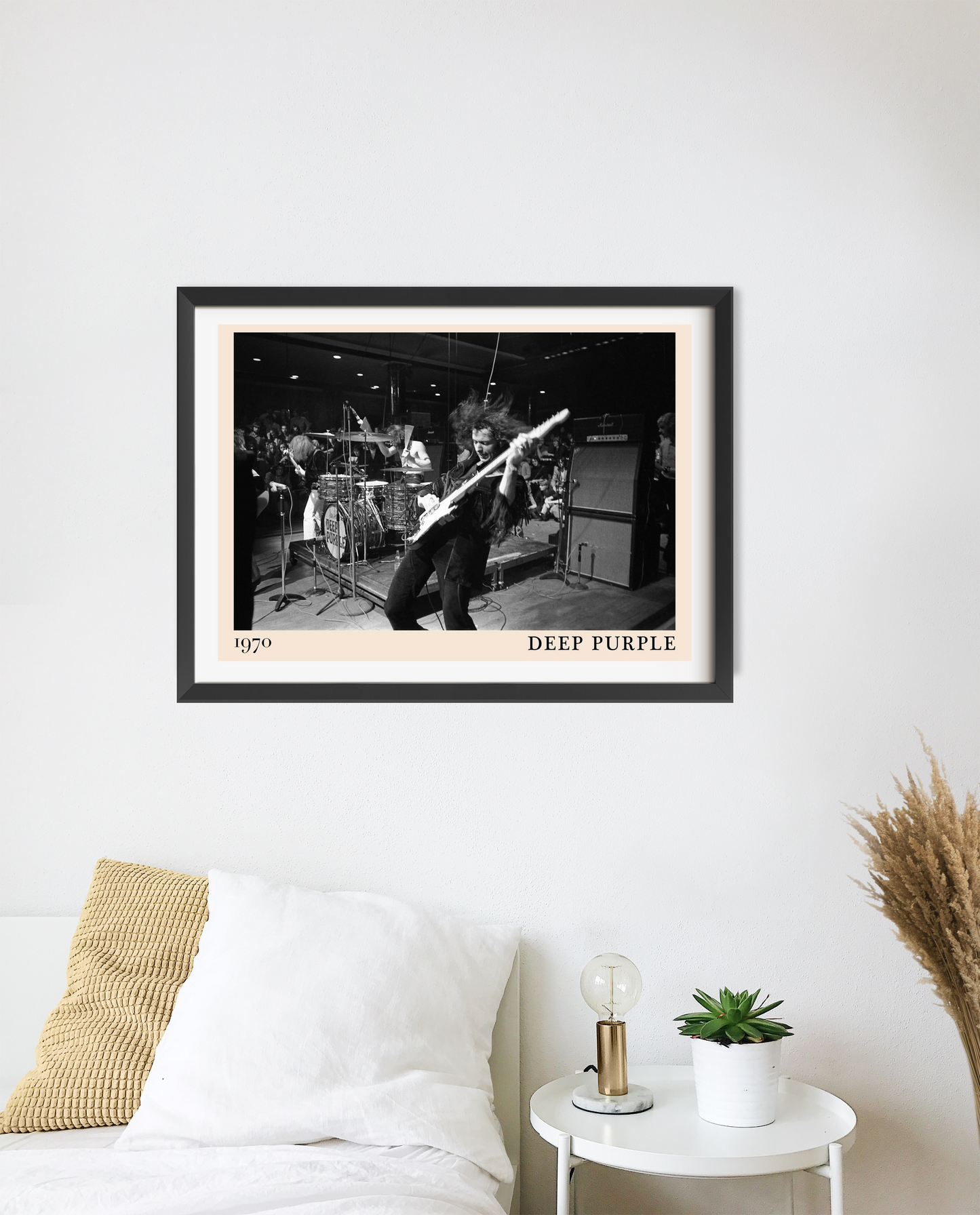 Deep Purple Rock Concert Poster in landscape 20 mount mockup above a modern bed, features black and white live band photo.