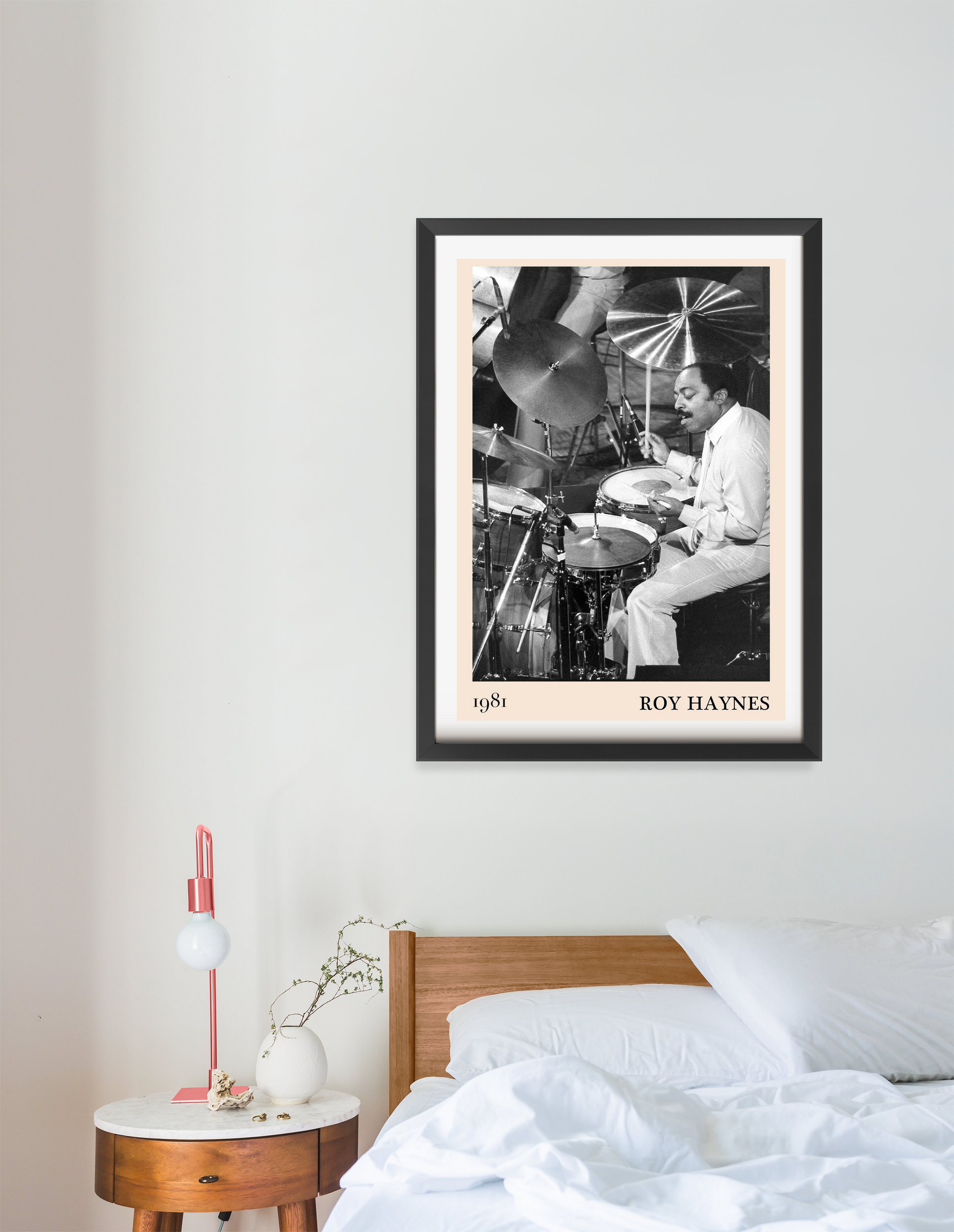 Roy Haynes Jazz Concert Poster in portrait 16 mount mockup above a modern bed, black and white drummer design, minimalist dec