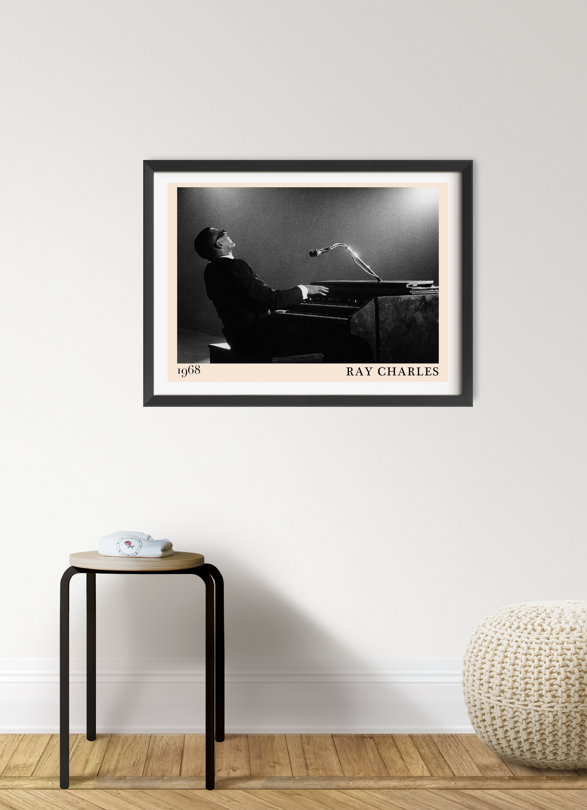 Ray Charles Iconic Jazz Concert Poster in black frame, landscape 7 mount, on modern wall above minimalist stool and pouf.