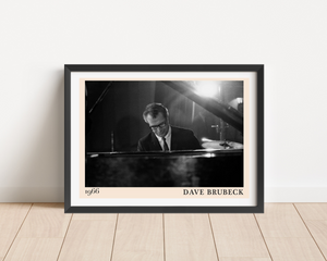 Dave Brubeck Retro Jazz Poster in landscape mount mockup, black and white pianist photo with beige border on wood floor