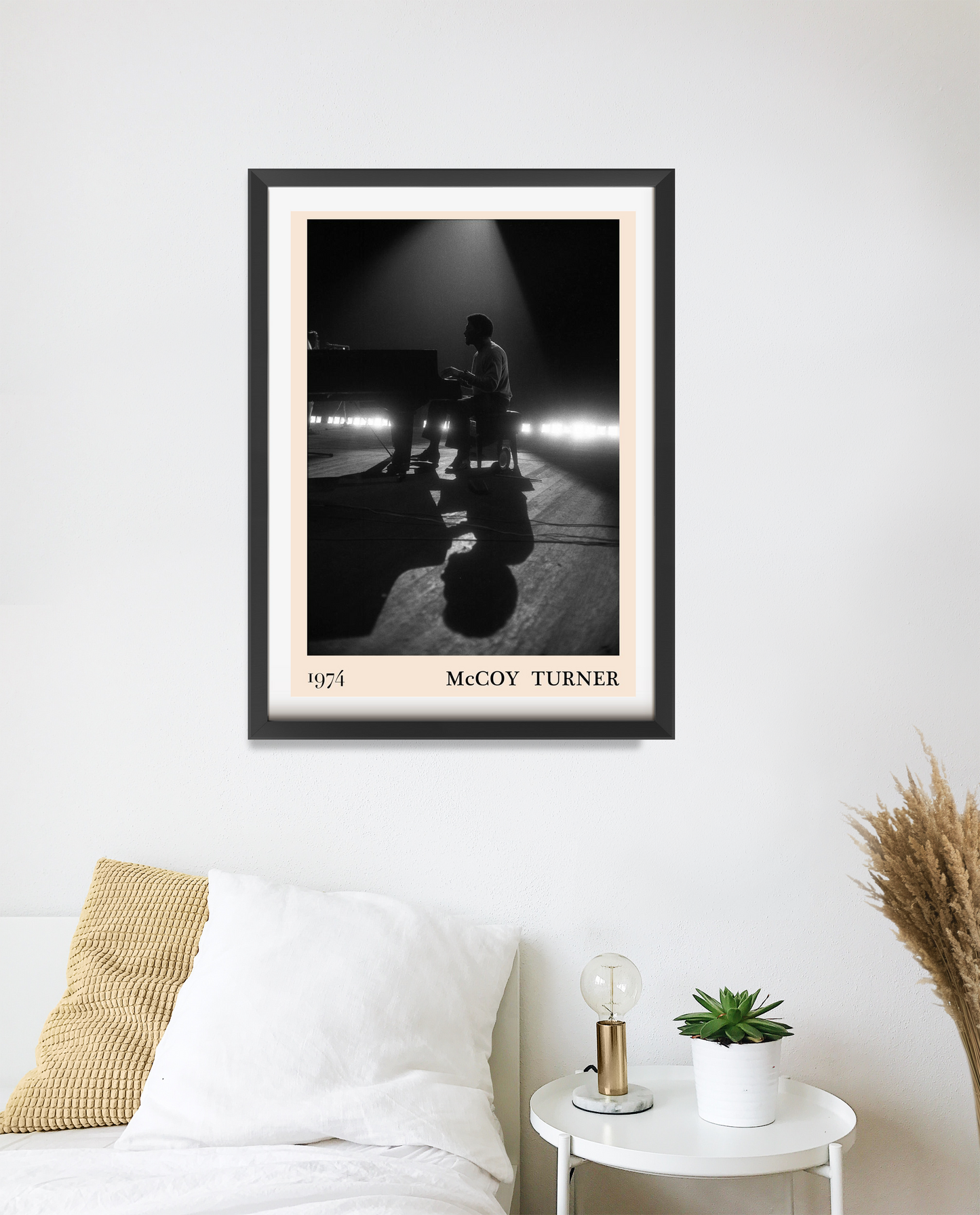 McCoy Turner Jazz Concert Poster in portrait 20 mount mockup, black and white piano stage scene above modern bed decor.