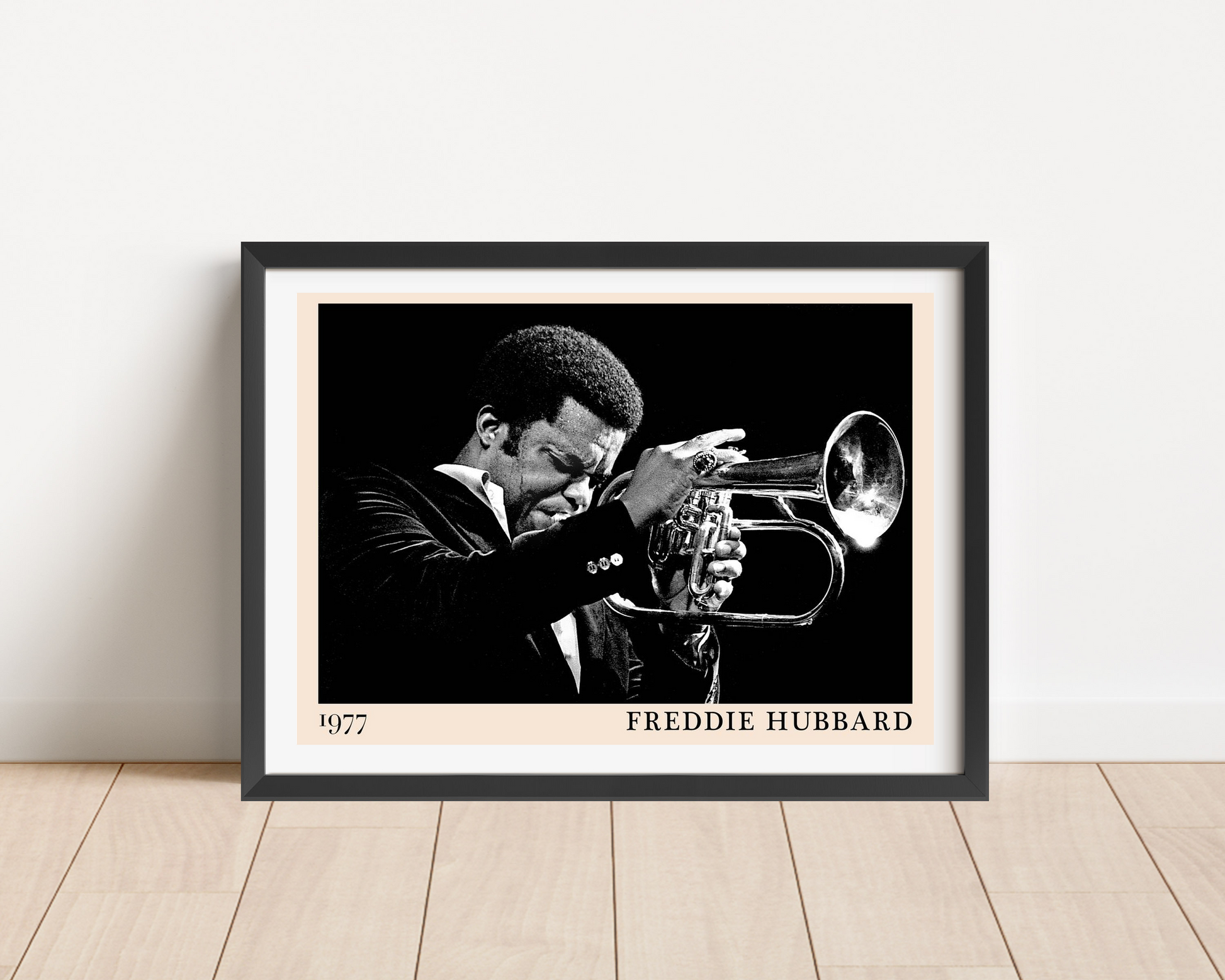 Freddie Hubbard Retro Jazz Print in landscape mount mockup, black and white trumpet design, framed on wood floor.