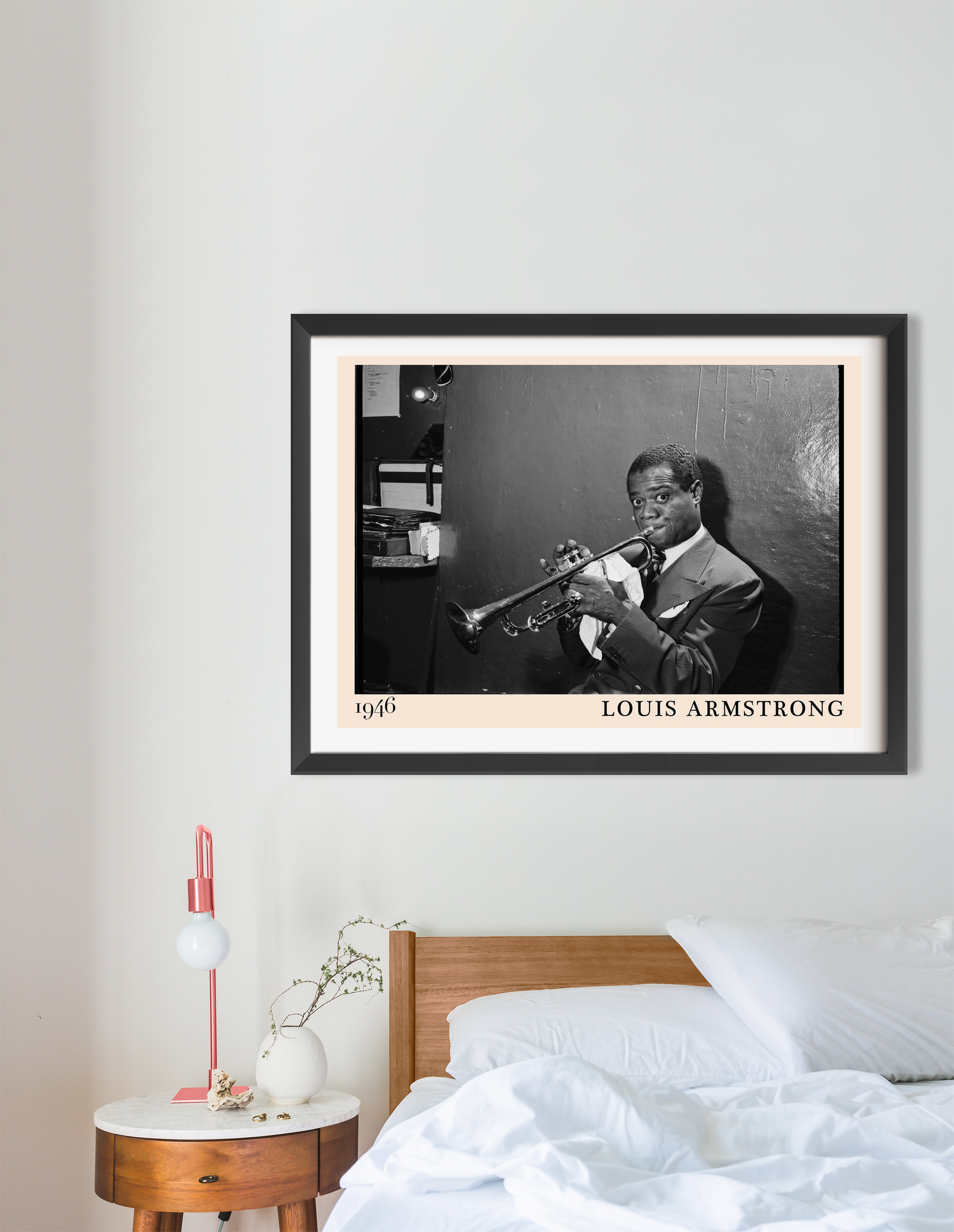 Louis Armstrong vintage jazz poster in landscape 16 mount mockup, black and white photo above modern wooden bed setup.