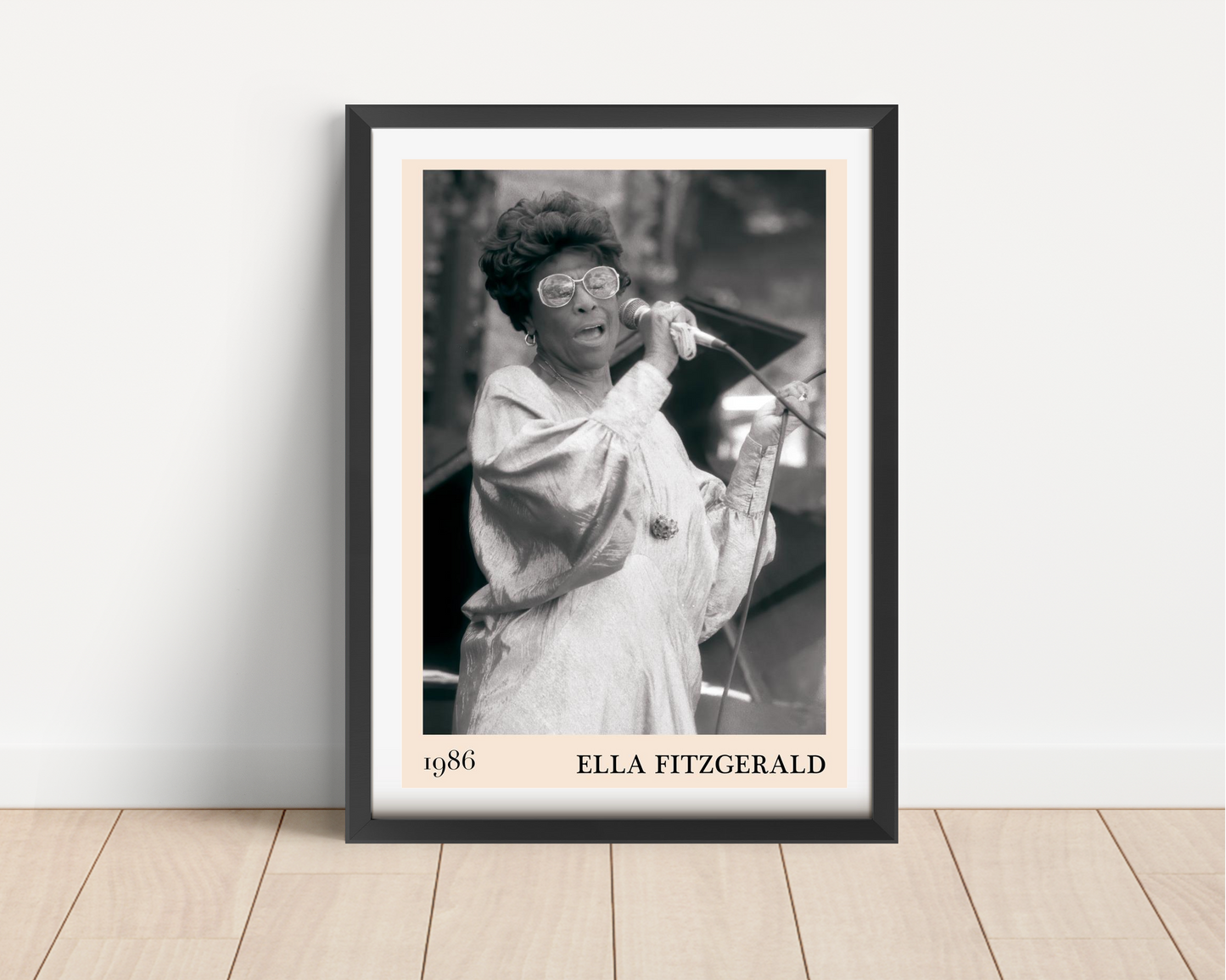 Ella Fitzgerald Retro Jazz Print in portrait mount mockup, black frame on wood floor, vintage concert design, 1986 text