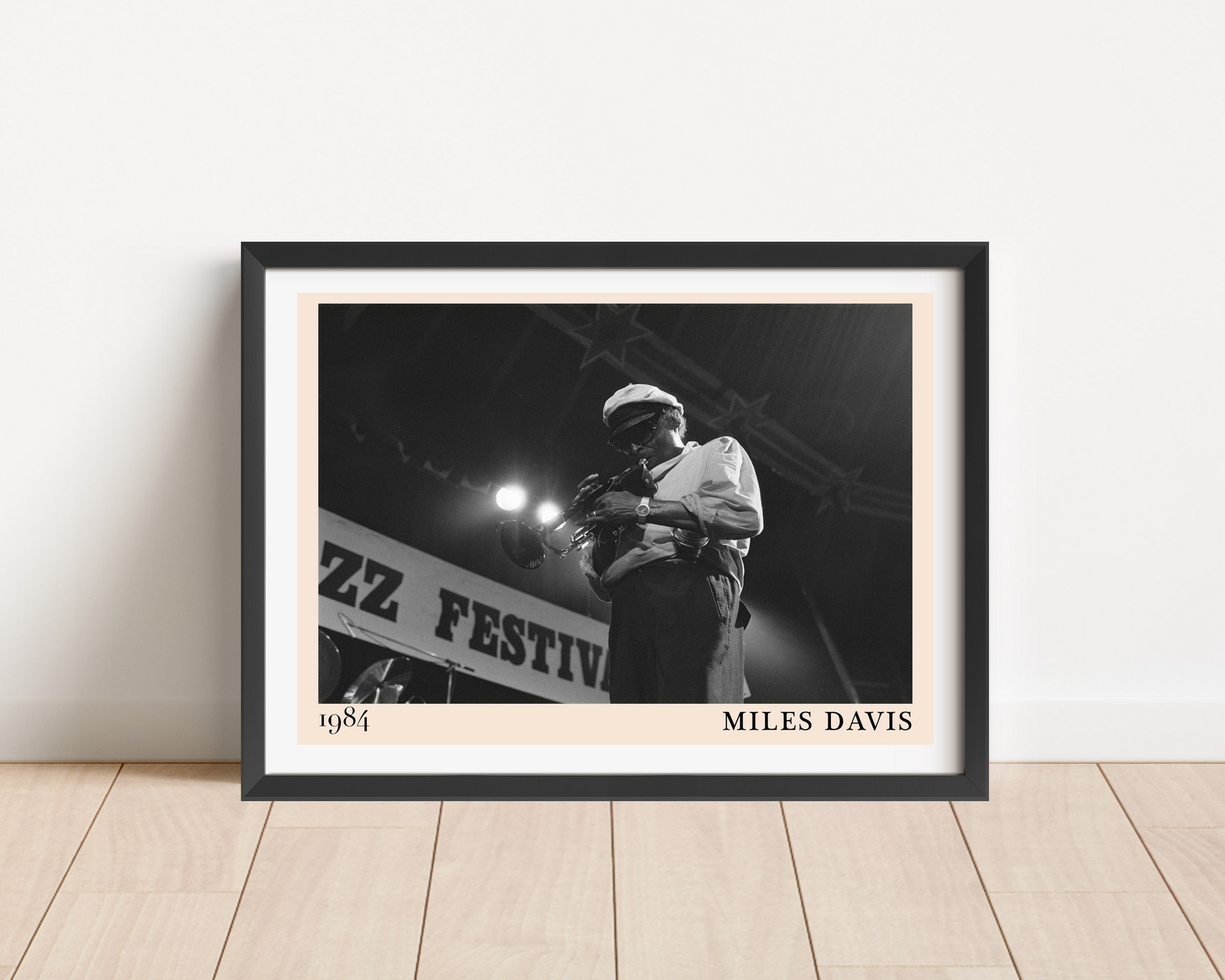 Miles Davis vintage jazz poster in landscape main mount mockup, framed on wooden floor with bold black and white design.