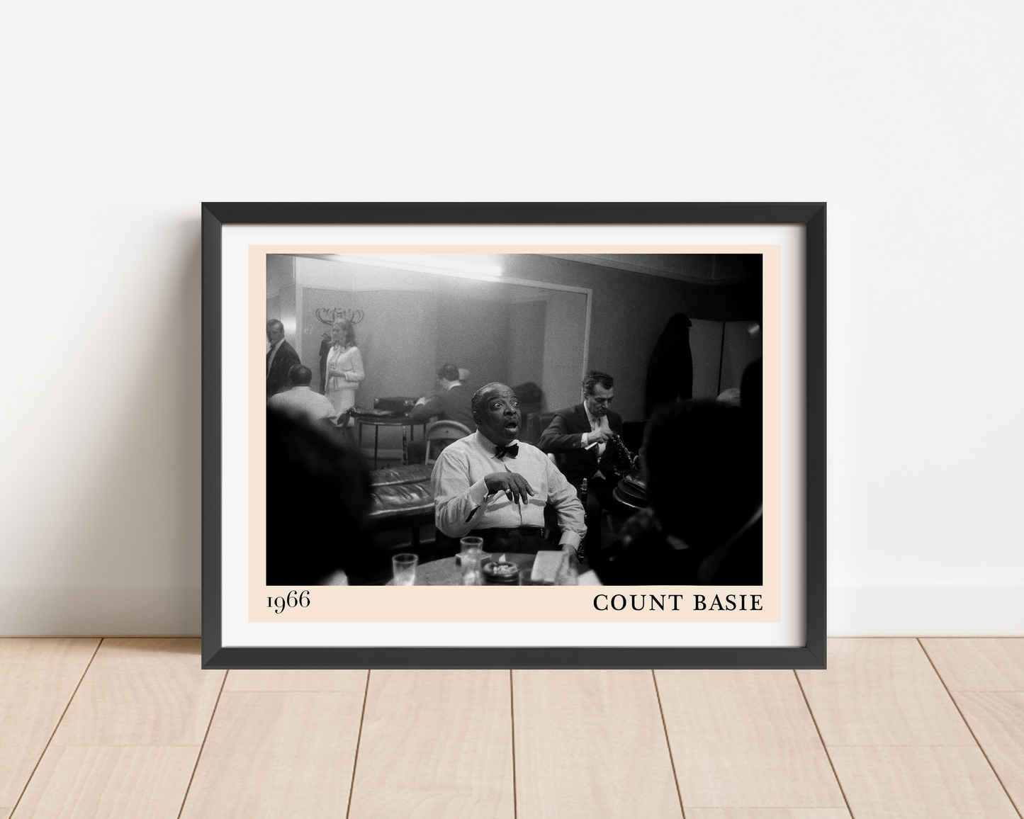 Count Basie Iconic Jazz Poster in landscape main mount mockup, black frame on wood floor, classic 1966 jazz scene design