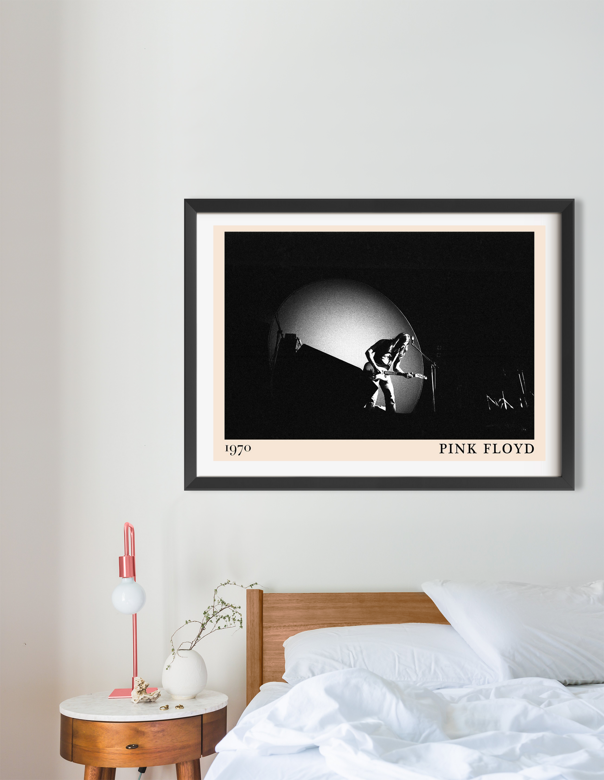 Pink Floyd Retro Rock Poster in a 16 mount landscape mockup above a wooden bed, featuring a black and white concert design.