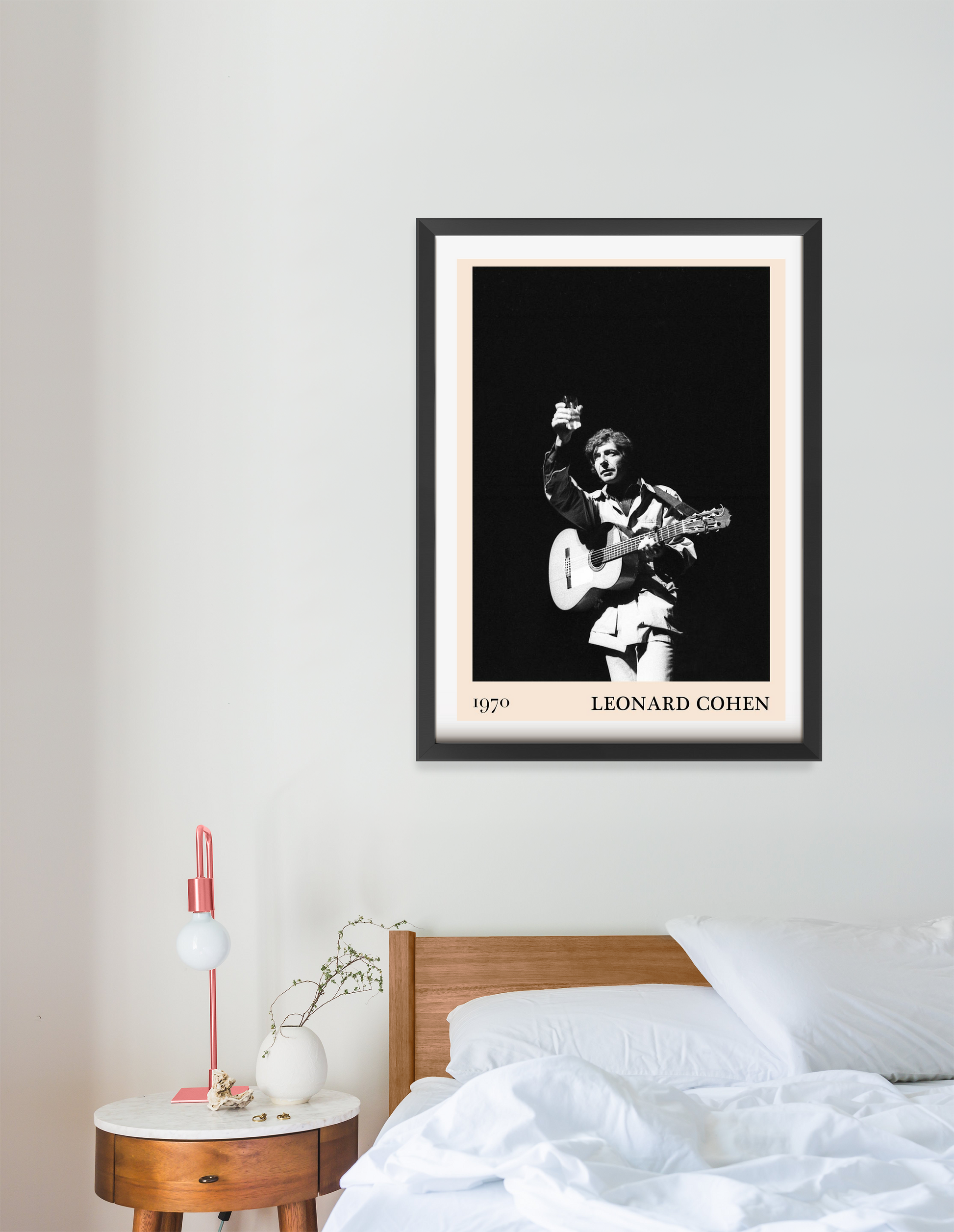 Leonard Cohen retro concert poster in portrait 16 mount mockup above a modern wooden bed, black and white vintage design.