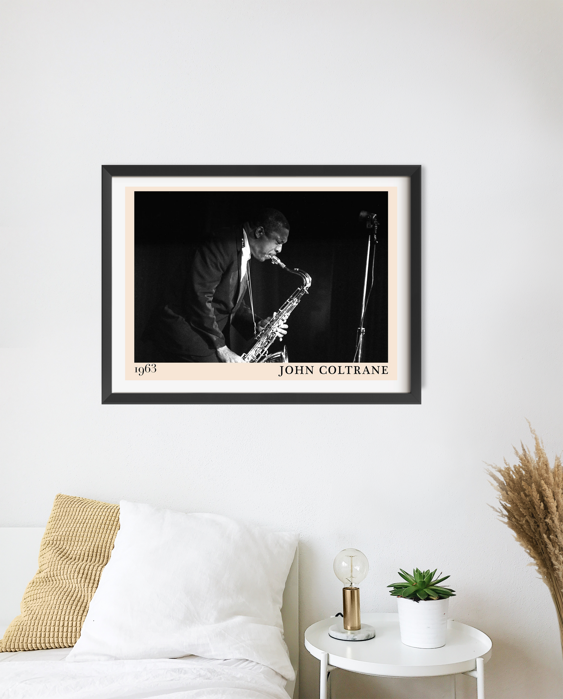 John Coltrane Jazz Concert Poster in landscape 20 mount mockup, black and white saxophone design above modern bed decor.