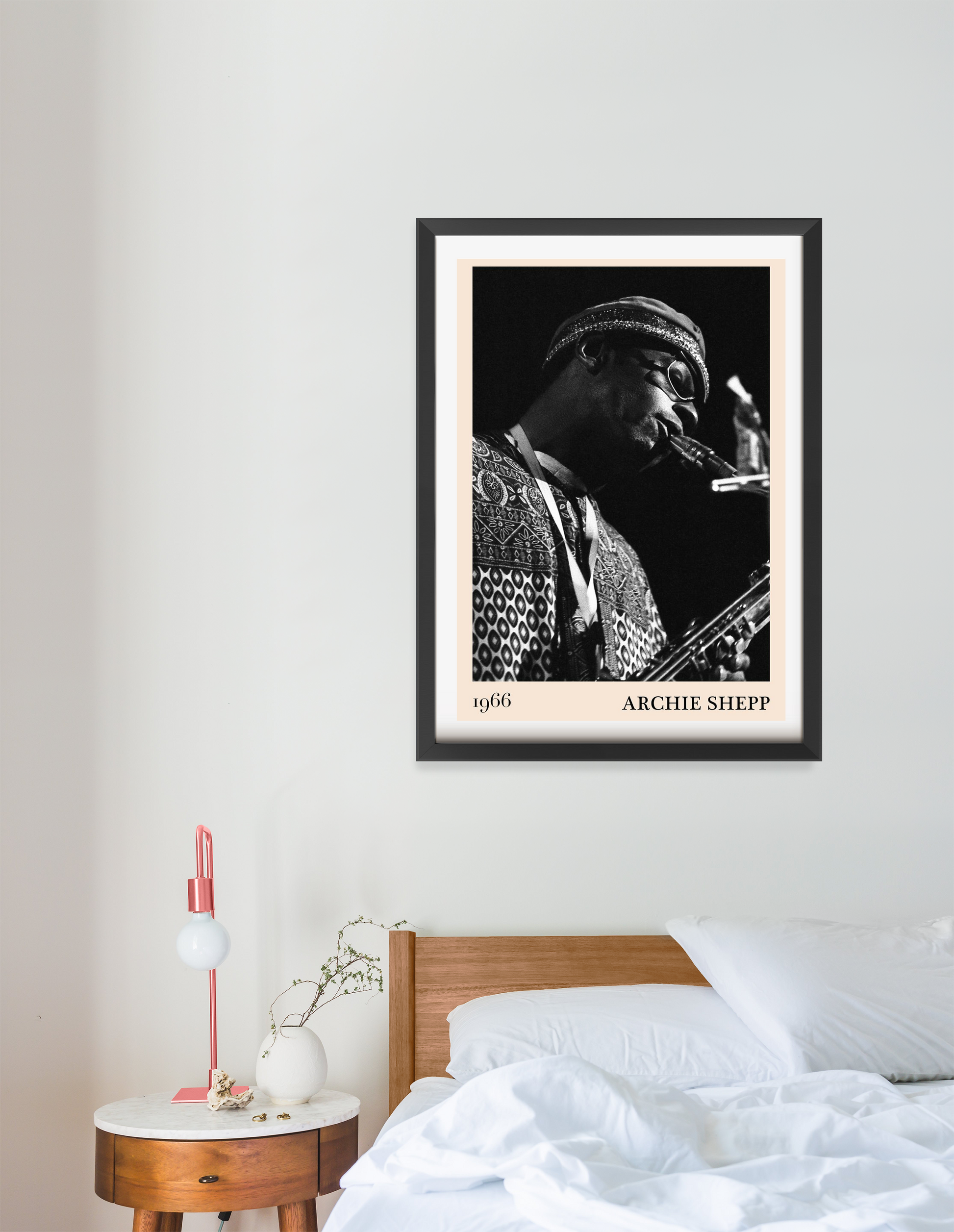 Archie Shepp Jazz Concert Poster in portrait 16 mount mockup above a modern bed, black and white saxophone player design.