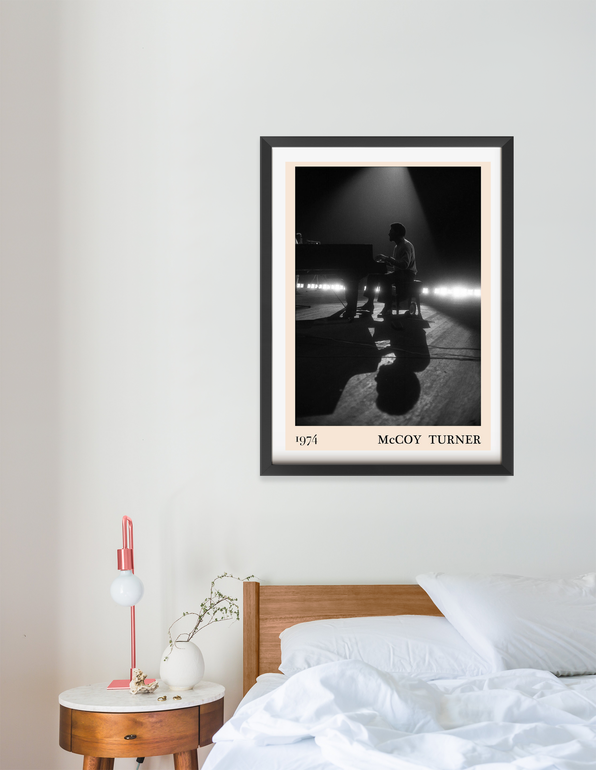 McCoy Turner Jazz Concert Poster in a modern portrait 16 mount mockup above a wooden bed, featuring a black and white stage s