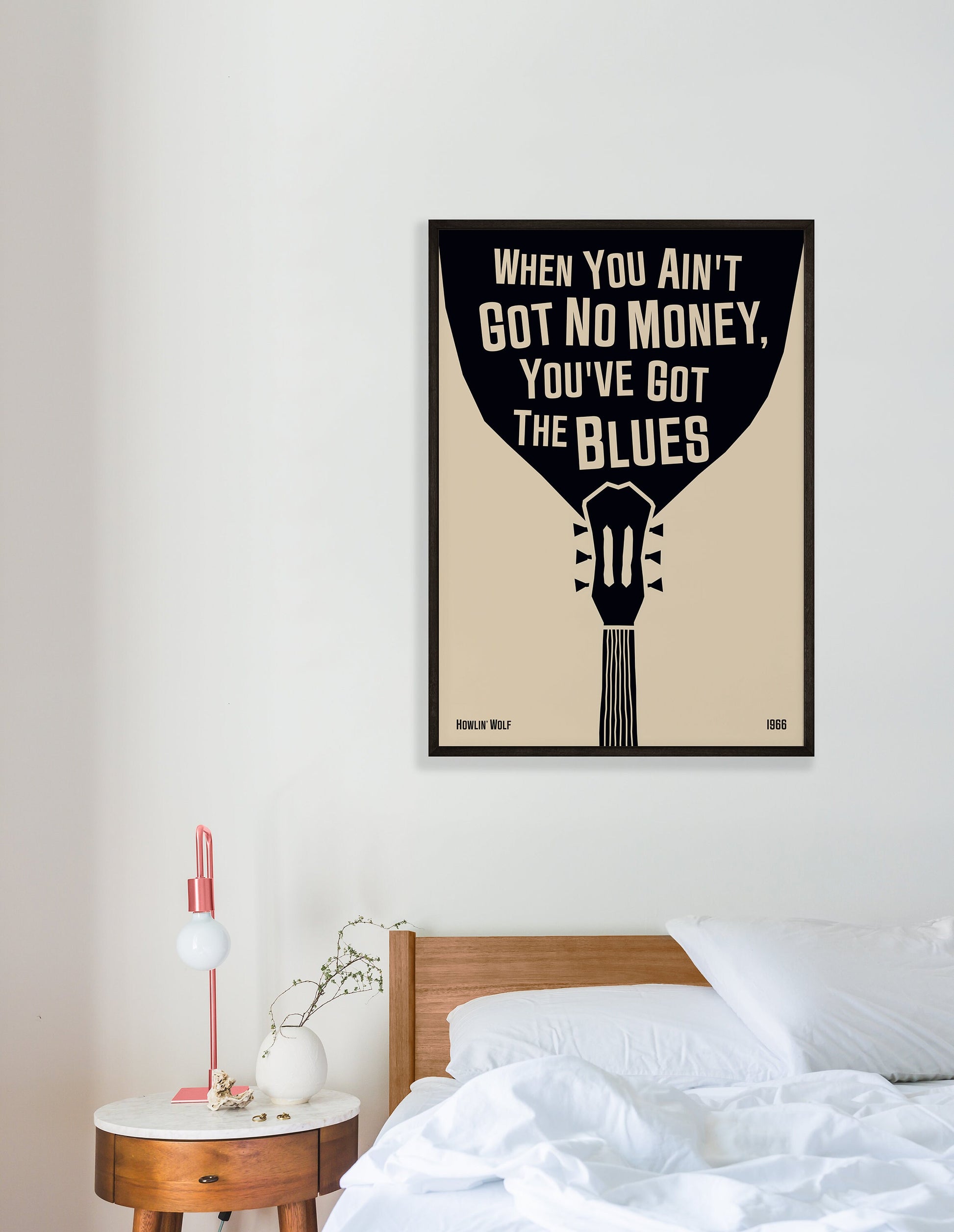 Cool blues music poster with guitar design, featuring a Howlin' Wolf quote. Retro black frame print, hanging on a white bedroom wall, perfect home decor.