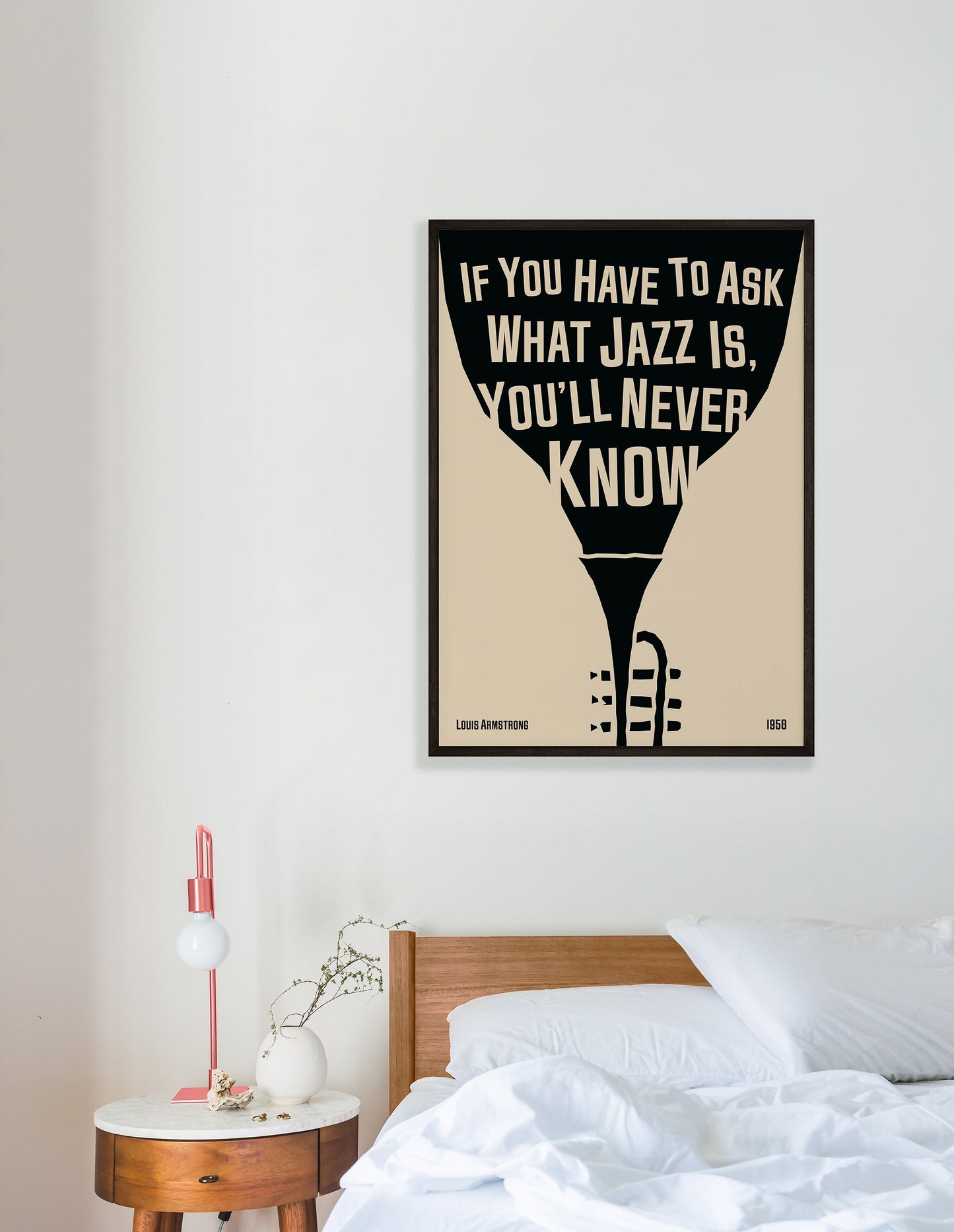 Cool jazz music poster with trumpet design, featuring a Louis Armstrong quote. Retro black frame print, hanging o a white bedroom wall, perfect home decor.