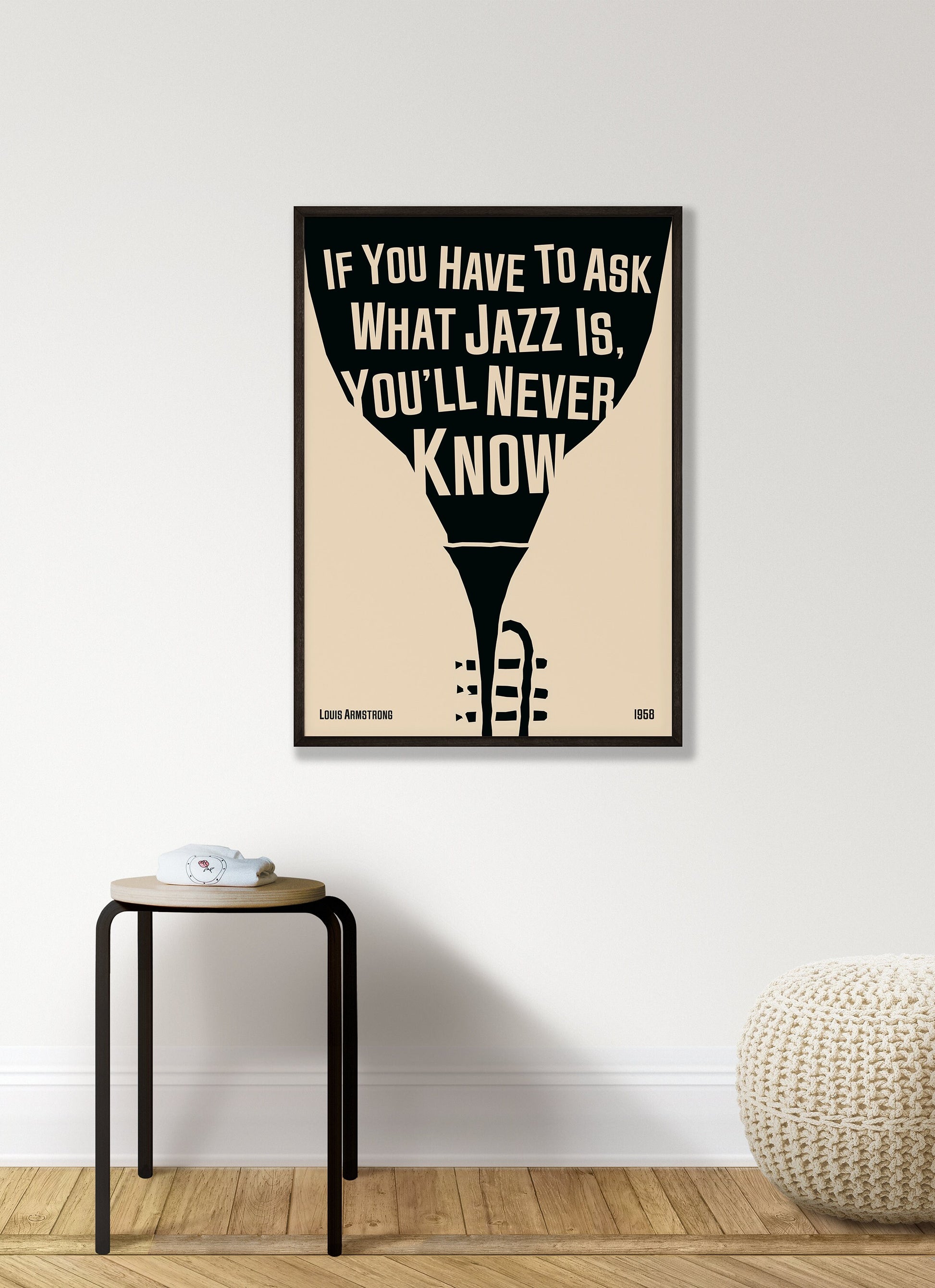 Cool jazz music poster with trumpet design, featuring a Louis Armstrong quote. Retro black frame print, hanging on a white living room wall, perfect home decor.