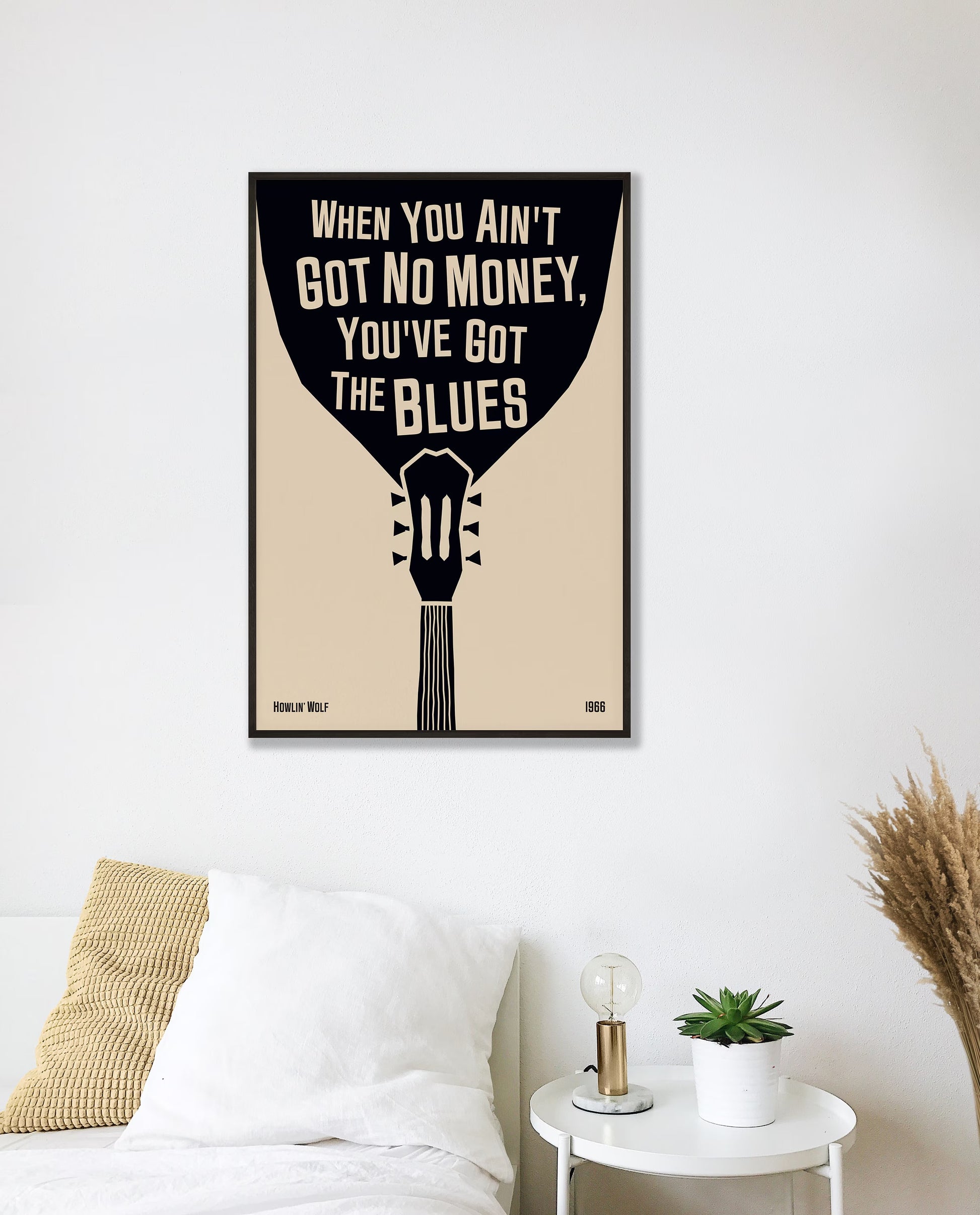 Cool blues music poster with guitar design, featuring a Howlin' Wolf quote. Retro black frame print, hanging on a white bedroom wall, perfect home decor.