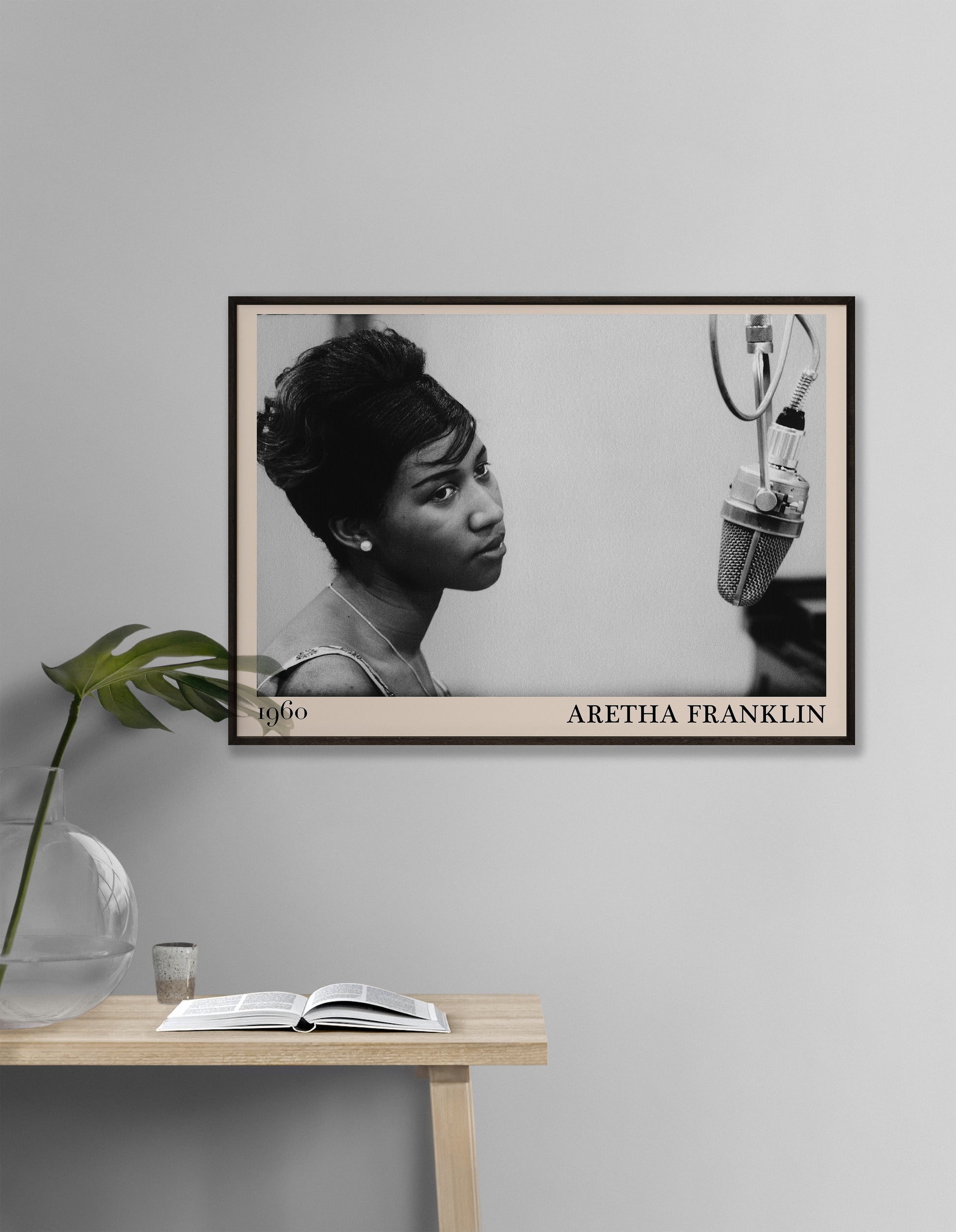 Framed Aretha Franklin Jazz Poster on a white hallway wall